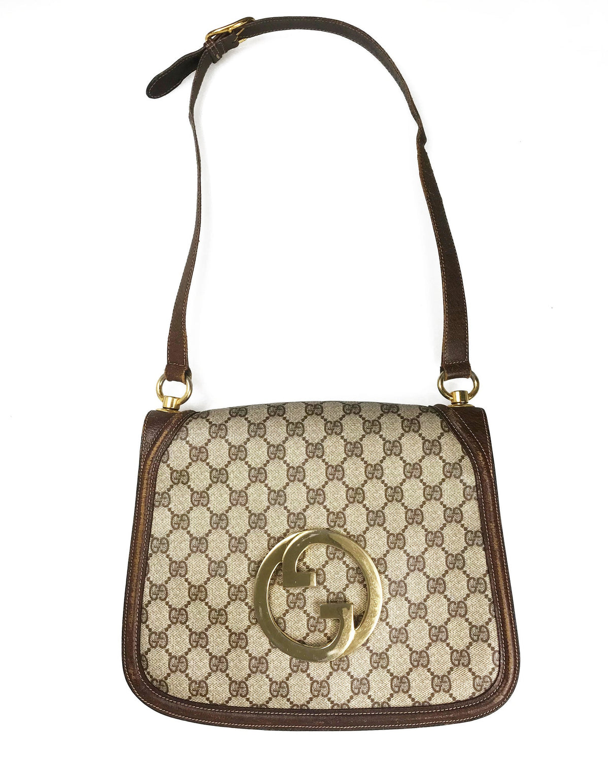 FRUIT Vintage Gucci 1973 Blondie logo monogram canvas shoulder bag features a very large front double G Gucci Logo at the front, a classic flap closure, brown leather trim and internal zipper pocket.