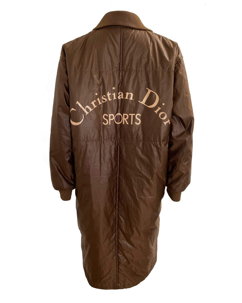 FRUIT vintage Christian Dior Sport Brown Logo puffer coat from the 1980s. It features a classic 1980s bomber style and large Christian Dior Sport text logo printed at rear.