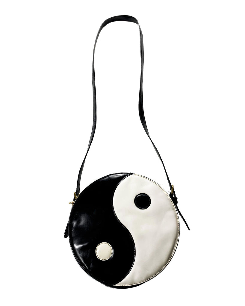 FRUIT Vintage rare Moschino Yin Yang Bag. Dating to the 1990s, the round purse has a large Yin Yang motif on the front made from appliquéd leather.