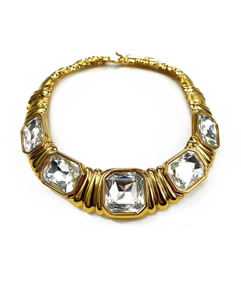 Fruit Vintage 1980s Yves Saint Laurent crystal collar choker necklace. It features 5 very large cut glass/crystals, heavy gold plating in a deep yellow tone and a reticulated moving design.