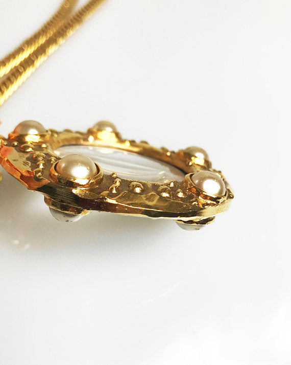 Fruit Vintage Chanel rare 1980s Gold Pearl Loupe Eyeglass Pendant with textured logo.