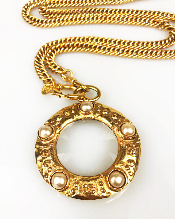 Fruit Vintage Chanel rare 1980s Gold Pearl Loupe Eyeglass Pendant with textured logo.