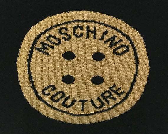 FRUIT Vintage Moschino Couture knit sweater from the 1990s. This amazing piece is made from a super soft wool/cashmere blend with an large intarsia style knitted gold front Moschino monogram logo