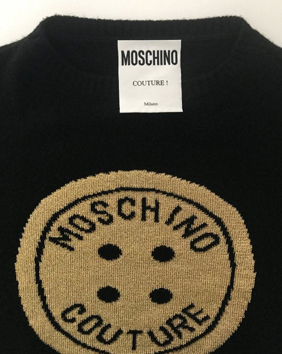 FRUIT Vintage Moschino Couture knit sweater from the 1990s. This amazing piece is made from a super soft wool/cashmere blend with an large intarsia style knitted gold front Moschino monogram logo