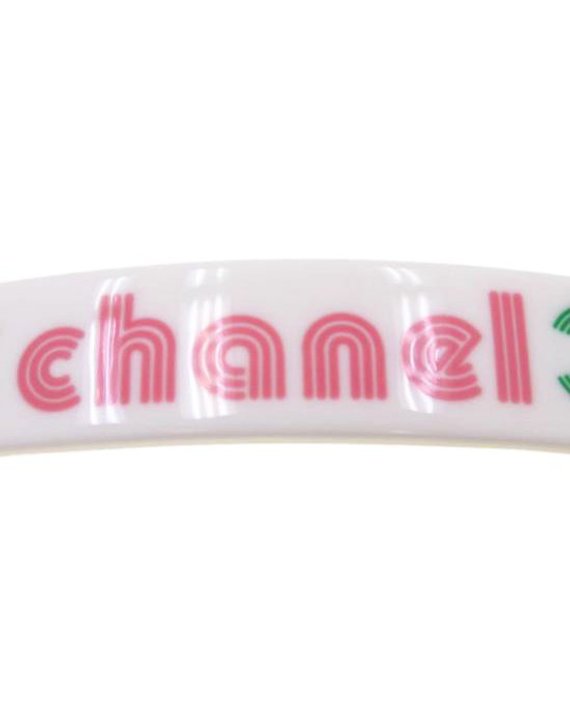 Fruit Vintage Chanel text logo barrette in white with bright logos. Features large Chanel text logos and two CC monograms either side.