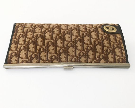 FRUIT vintage 1970s Christian Dior clutch bag is made of Brown oblique monogram logo trotter print canvas and features a gold hardware clip top closure. 