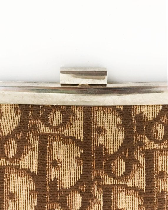 FRUIT vintage 1970s Christian Dior clutch bag is made of Brown oblique monogram logo trotter print canvas and features a gold hardware clip top closure. 