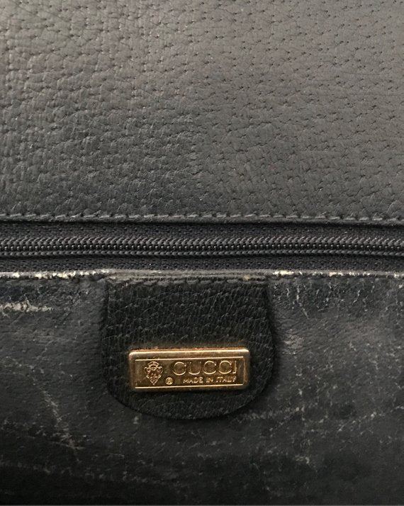  Fruit Vintage Gucci 1980s Logo embellished cross body satchel bag in a navy coated version of the classic Gucci monogram canvas. 