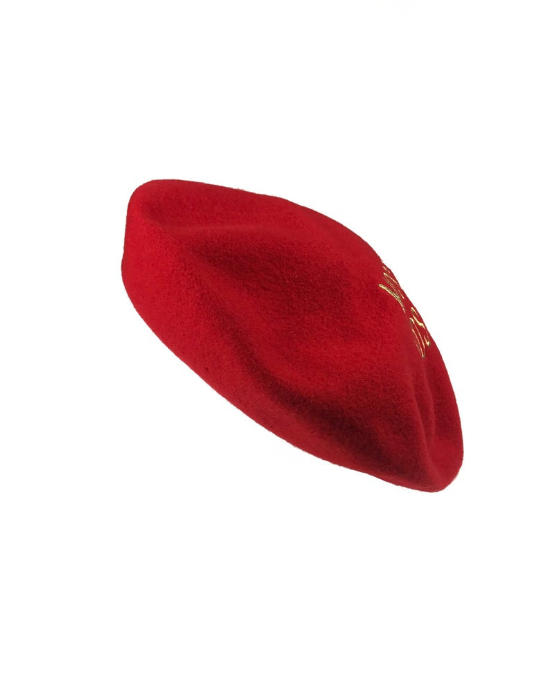 FRUIT Vintage Moschino logo beret hat. It features large embroidered gold text with the slogal "Moschinon Moschinoff" and a classic beret hat shape.