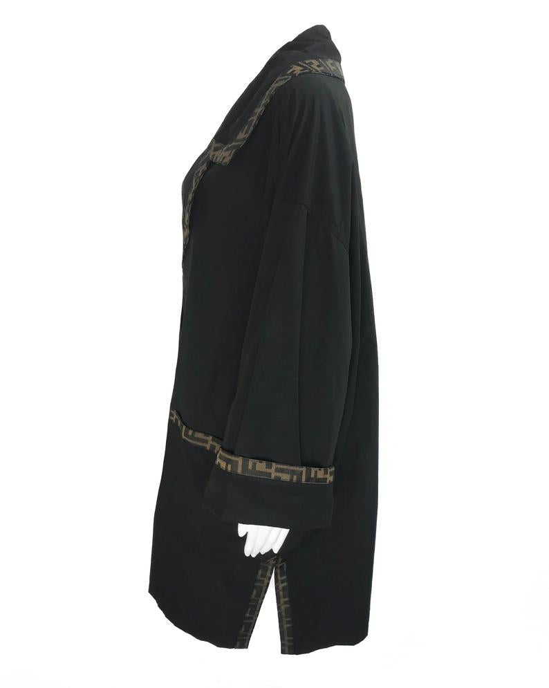FRUIT Vintage Fendi 1990s oversized cocoon coat with iconic Zucca logo print trim.