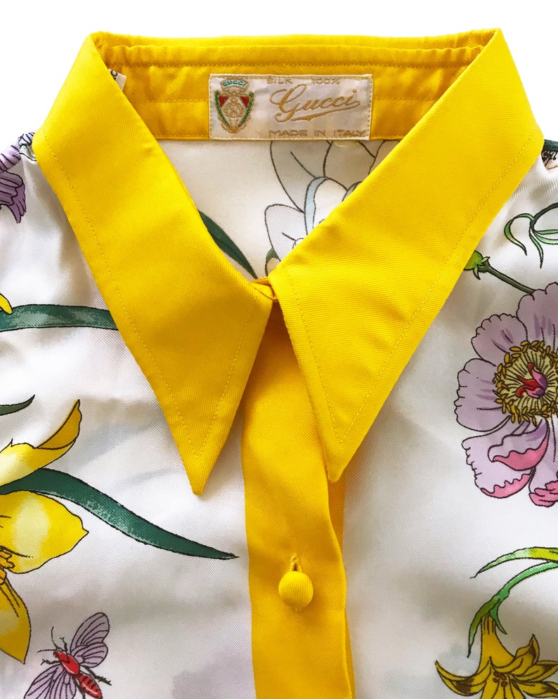 FRUIT vintage rare Gucci silk flora print shirt dating to the 1980s. It features the classic Gucci flora design from the era trimmed with vibrant yellow. This is a true piece of Gucci history!