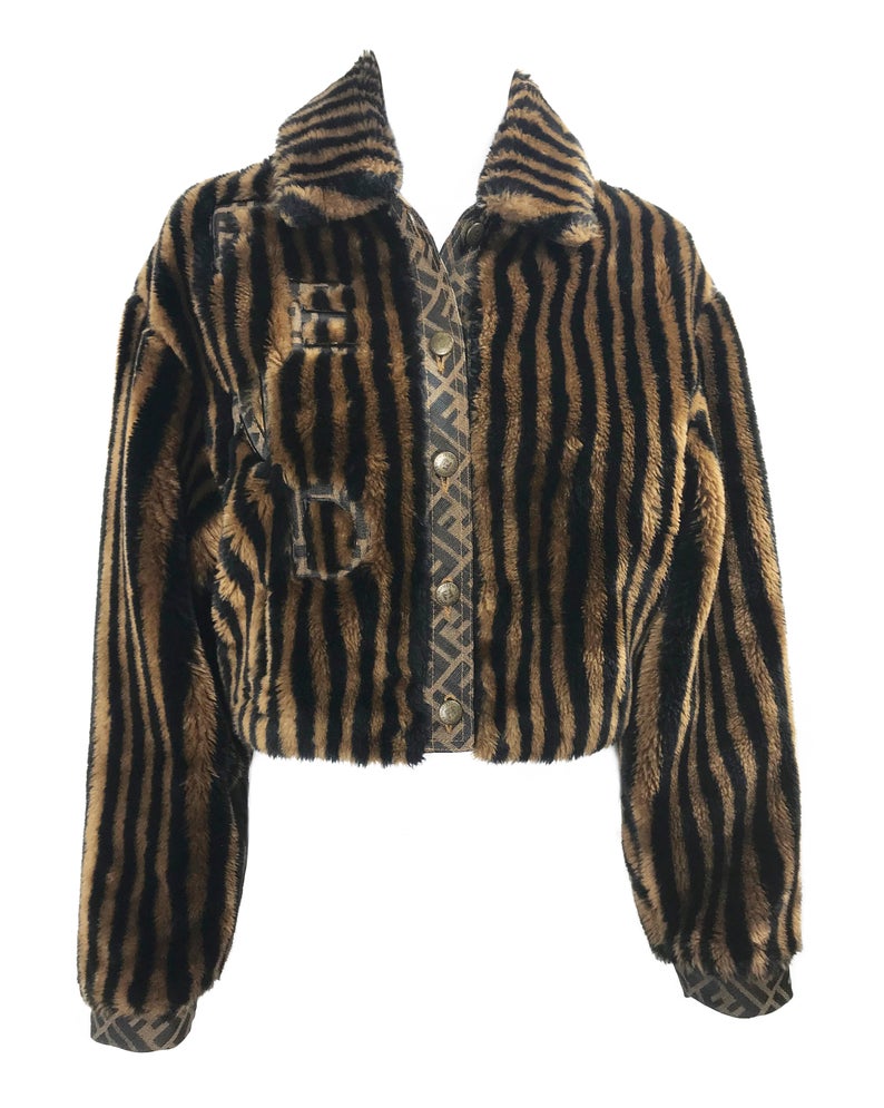 FRUIT Vintage Fendi faux fur stripe bomber jacket dating to 1995. It features the classic Zucca logo trim and embroidered Zucca print Fendi letters, as worn by Mary J Blige