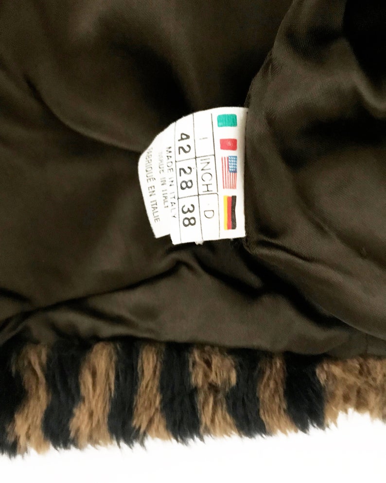 FRUIT Vintage Fendi faux fur stripe bomber jacket dating to 1995. It features the classic Zucca logo trim and embroidered Zucca print Fendi letters, as worn by Mary J Blige