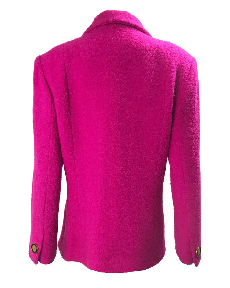 A fabulous bright pink Givenchy jacket dating to the 1980s. This bright piece features a contrast grey trim and large gold buttons.