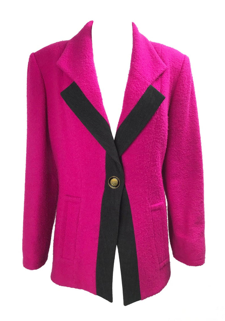 A fabulous bright pink Givenchy jacket dating to the 1980s. This bright piece features a contrast grey trim and large gold buttons.