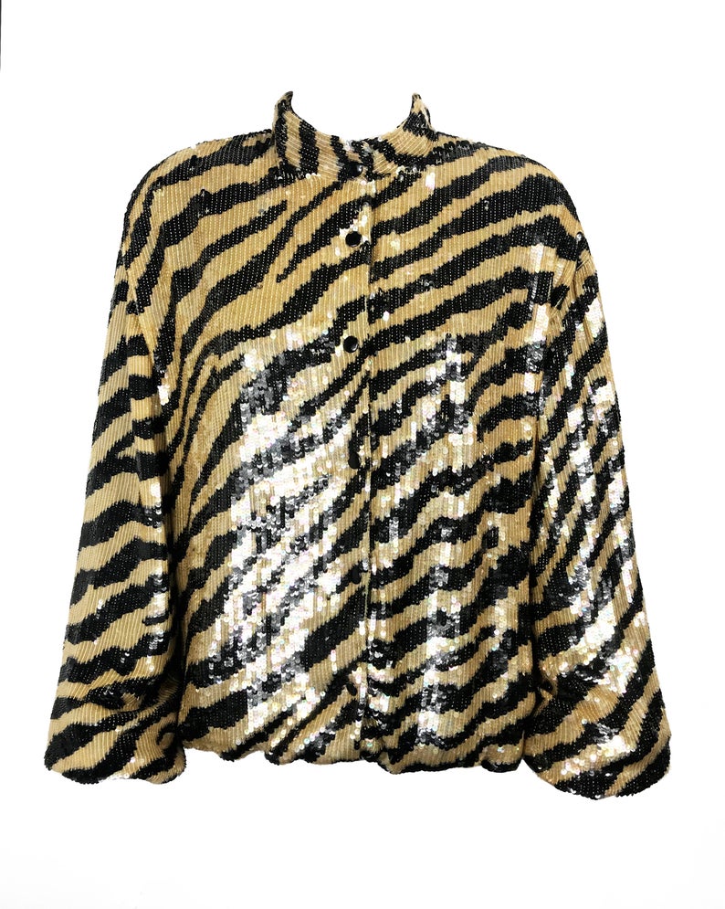 FRUIT Vintage sequinned zebra print bomber jacket by Jeanette Kastenberg for St Martin Sport. It features a bold full sequin 2 tone zebra print, push button closure and elasticated waist and sleeves