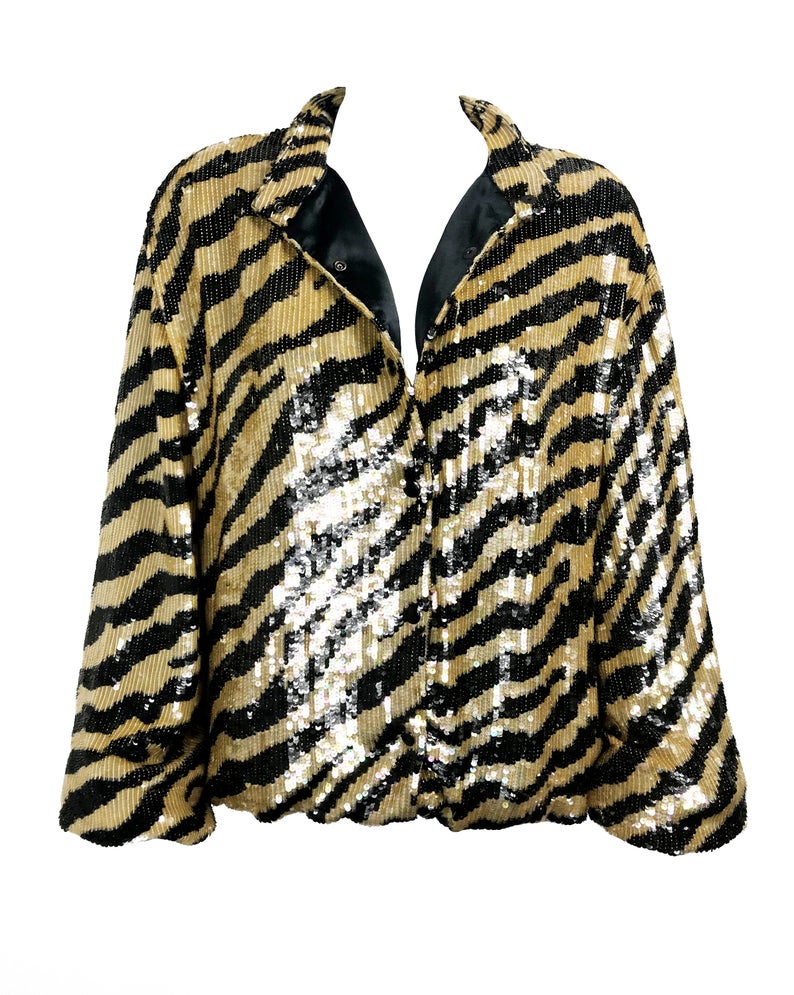 FRUIT Vintage sequinned zebra print bomber jacket by Jeanette Kastenberg for St Martin Sport. It features a bold full sequin 2 tone zebra print, push button closure and elasticated waist and sleeves