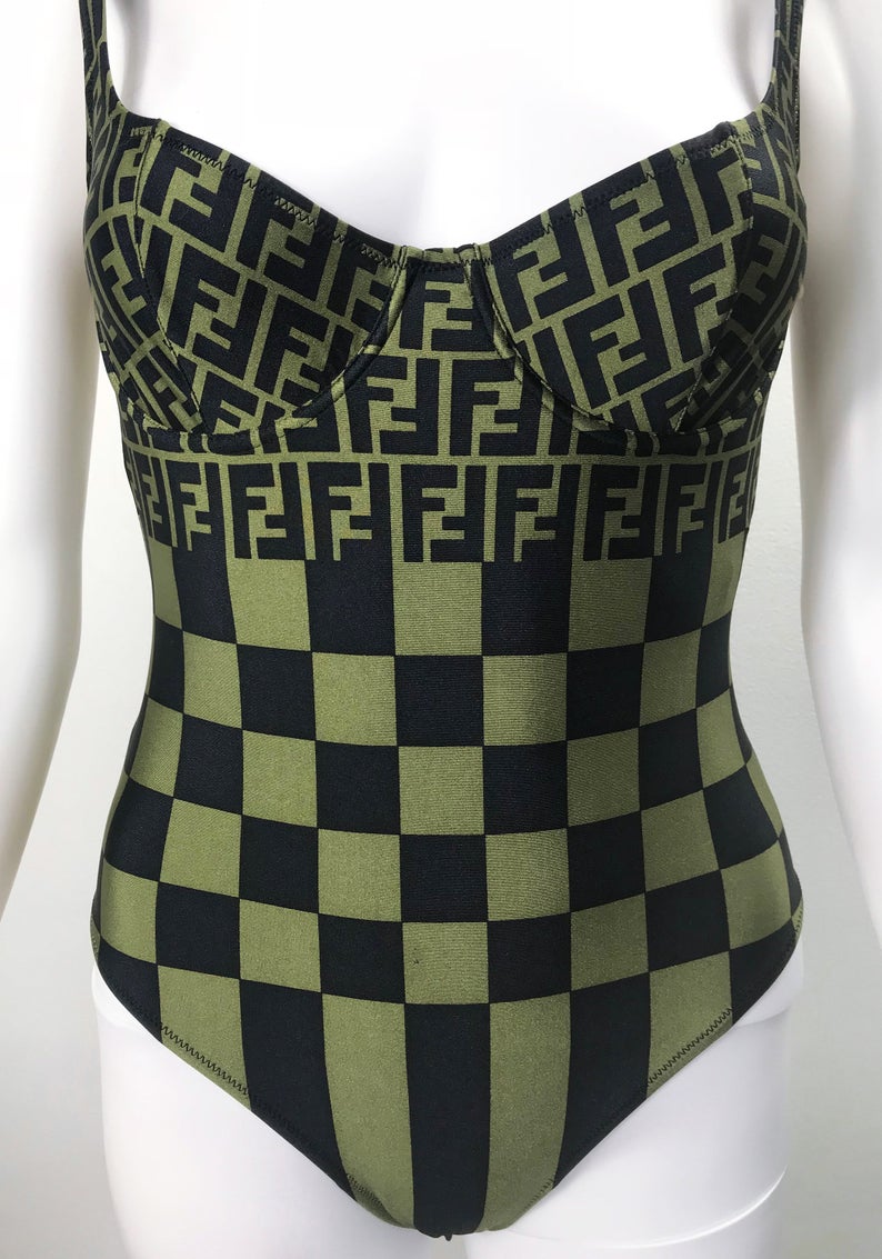 FRUIT vintage Mint condition Fendi Zucca print swimsuit from the 90s. This amazing monogram logo set is a collectors dream. Features a lingerie style bra top with the iconic Fendi logo monogram and Fendi checkerboard print design. This would also make an incredible bodysuit for day wear.