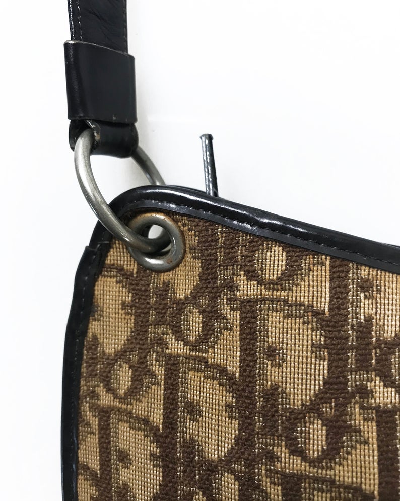FRUIT vintage 1970s Christian Dior brown monogram canvas handbag. Features a simple 'hobo' style shape perfect for wear on the shoulder, gold CD logo at front, and simple zip top closure.
