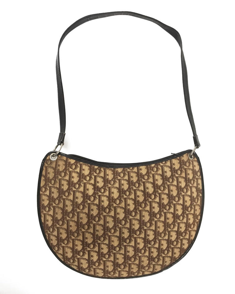 FRUIT vintage 1970s Christian Dior brown monogram canvas handbag. Features a simple 'hobo' style shape perfect for wear on the shoulder, gold CD logo at front, and simple zip top closure.