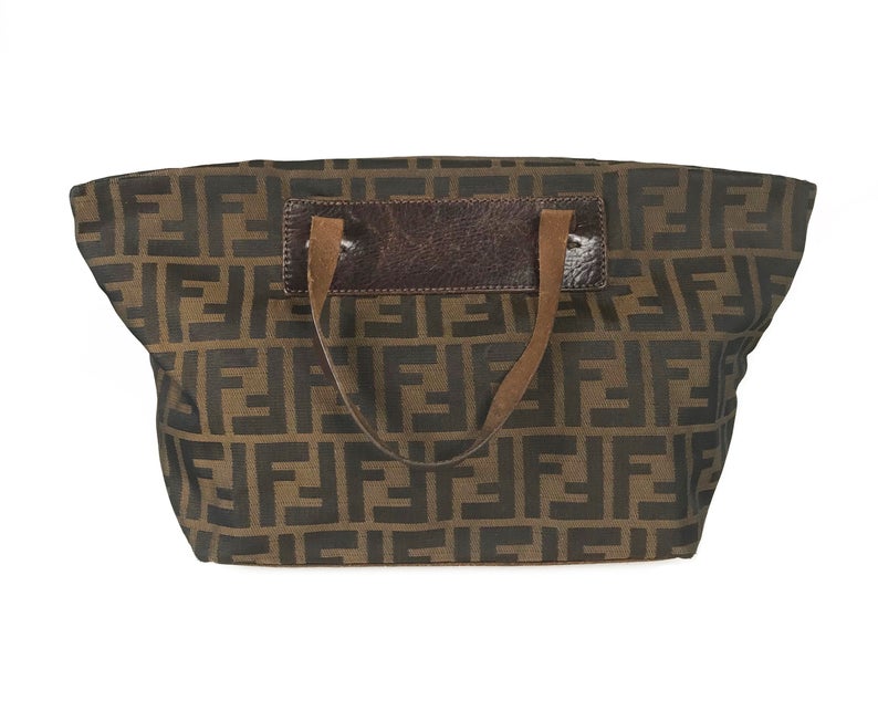FRUIT Vintage Fendi Zucca mini small logo tote bag in the classic Fendi Zucca canvas. It features leather handles and trim (its can be folded into a small square for travel!)