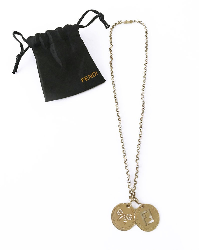 FRUIT Vintage Fendi zucca logo charm necklace in excellent condition. Features 2 removable charm pendants, one with cut-out Fendi logo F's and a second with crystal embellished bow symbol