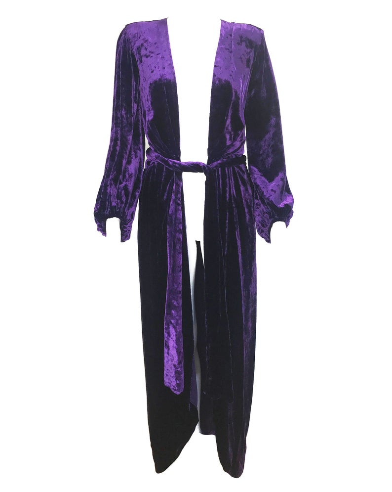 FRUIT Vintage Yves Saint Laurent Rive Gauche purple velvet gown dating to the 1970s. YSL dress features a plunging neckline, gorgeous 70s bell sleeves and removable wrap tie belt. It can be worn as a dress or unclipped and worn as a duster jacket/robe.
