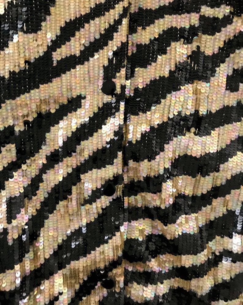 FRUIT Vintage sequinned zebra print bomber jacket by Jeanette Kastenberg for St Martin Sport. It features a bold full sequin 2 tone zebra print, push button closure and elasticated waist and sleeves