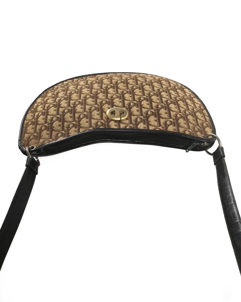 FRUIT vintage 1970s Christian Dior brown monogram canvas handbag. Features a simple 'hobo' style shape perfect for wear on the shoulder, gold CD logo at front, and simple zip top closure.