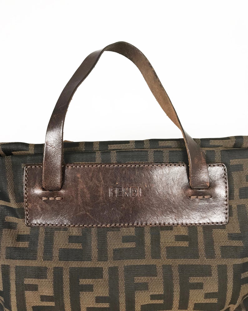 FRUIT Vintage Fendi Zucca mini small logo tote bag in the classic Fendi Zucca canvas. It features leather handles and trim (its can be folded into a small square for travel!)