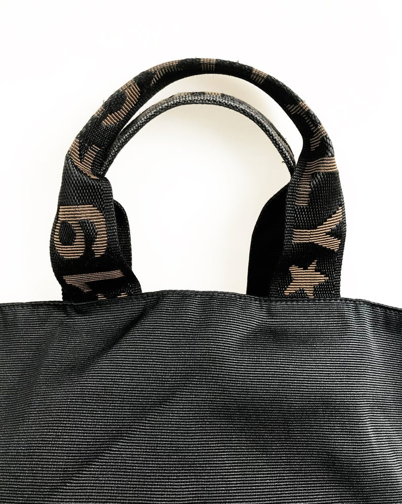 FRUIT Vintage Fendi Zucca small logo tote bag in durable nylon canvas. It features Fendi logo text at the front, monogram handles and internal seam trim, and top zipper closure. The bag can be buttoned to change shape into a more bucket shape also!