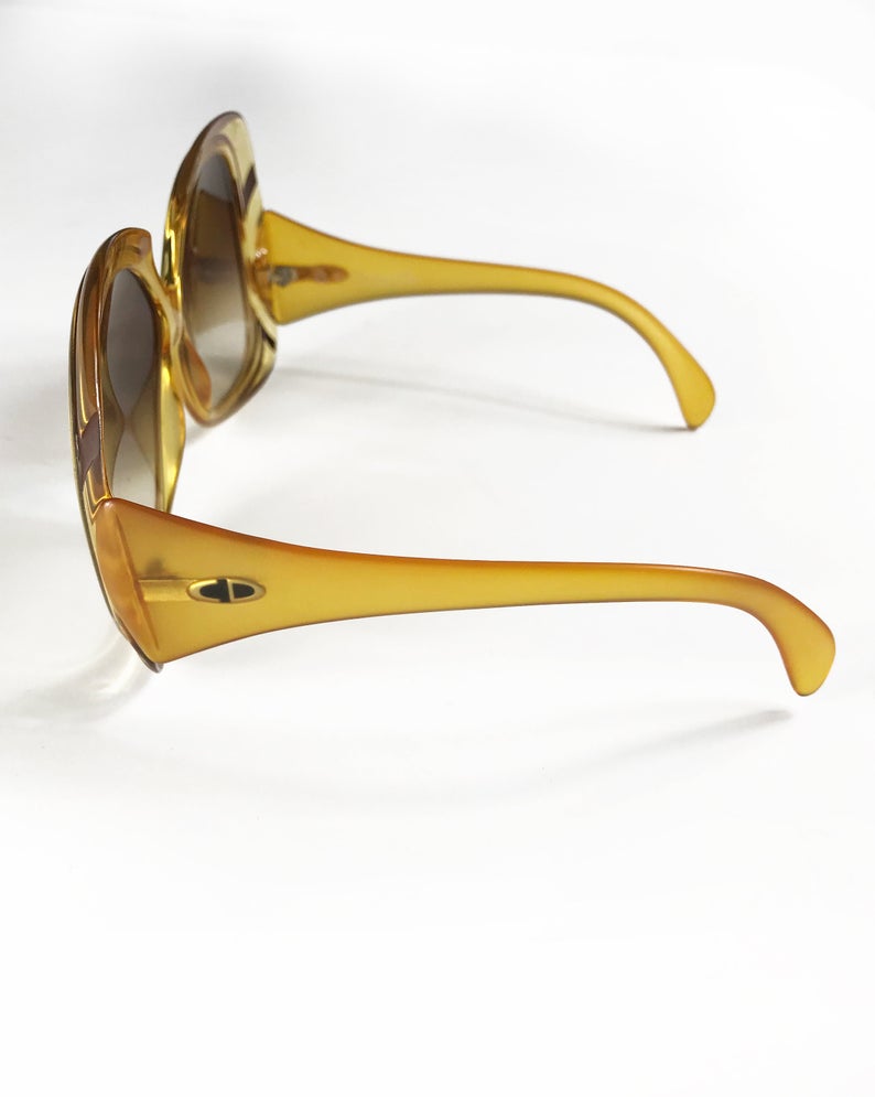 Fruit Vintage Christian Dior yellow 1970s oversize logo sunglasses in excellent condition. They feature Dior CD logos on each arm and brown gradient lenses.
