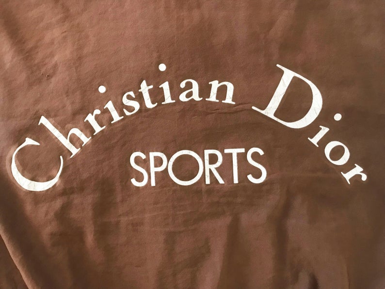 FRUIT vintage rare Christian Dior Sports Logo bomber jacket from the 1980s. It features a classic 1980s bomber jacket cut, and large Christian Dior Sport text logo printed at rear.