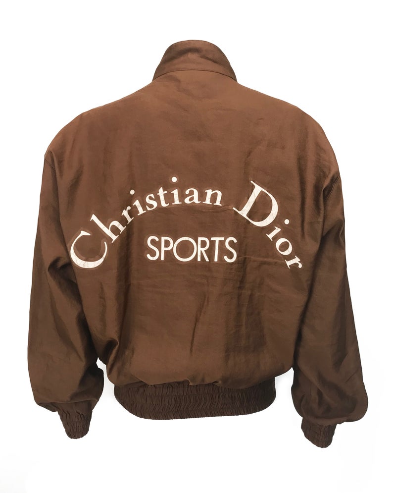 FRUIT vintage rare Christian Dior Sports Logo bomber jacket from the 1980s. It features a classic 1980s bomber jacket cut, and large Christian Dior Sport text logo printed at rear.