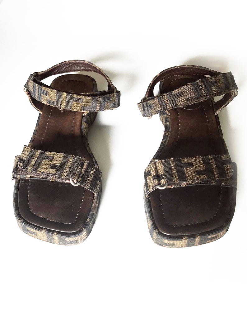 FRUIT Vintage Fendi Zucca monogram flat strap sandals dating to the 1990s, features velcro strap closure.