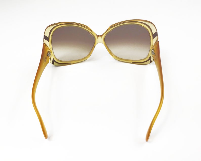 Fruit Vintage Christian Dior yellow 1970s oversize logo sunglasses in excellent condition. They feature Dior CD logos on each arm and brown gradient lenses.