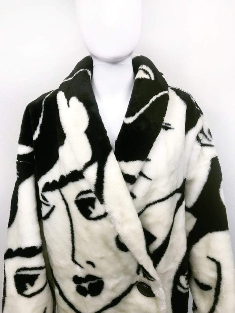 Fruit Vintage Donnybrook Faces Coat. Original 1980s Faux Fur cocoon coat with a relaxed, oversized silhouette. Features bold beige/black graphic custom Donnybrook face print.