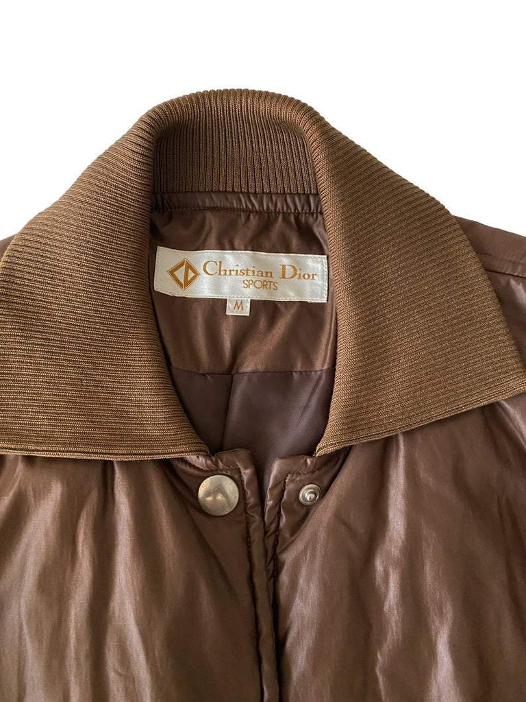 FRUIT vintage Christian Dior Sport Brown Logo puffer coat from the 1980s. It features a classic 1980s bomber style and large Christian Dior Sport text logo printed at rear.