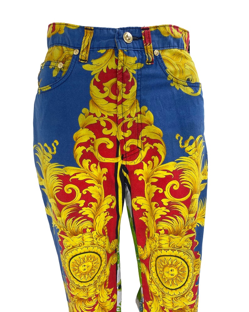 FRUIT Vintage Versace pants from the Jeans Couture collection. This is a lifetime Gianni Versace piece from the 1990s, it features the iconic 'Baroque' Print with Miami palms at the rear.