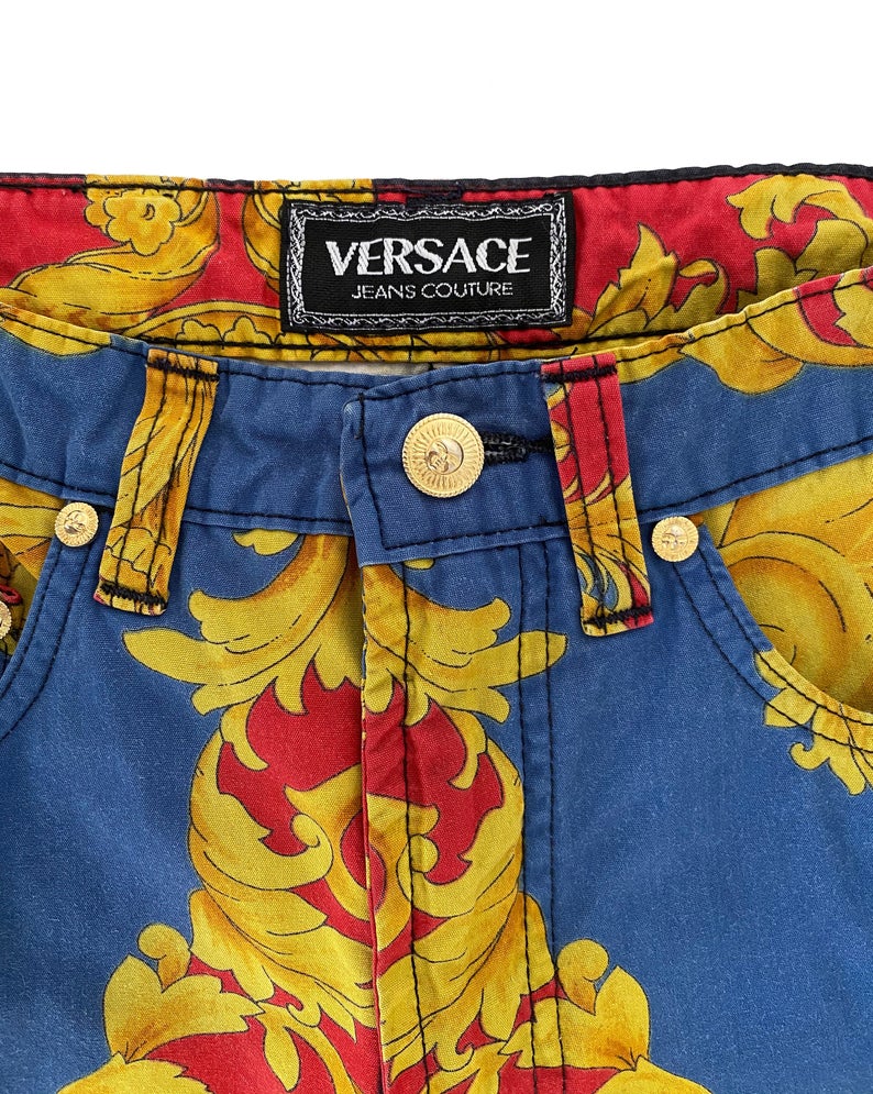 FRUIT Vintage Versace pants from the Jeans Couture collection. This is a lifetime Gianni Versace piece from the 1990s, it features the iconic 'Baroque' Print with Miami palms at the rear.