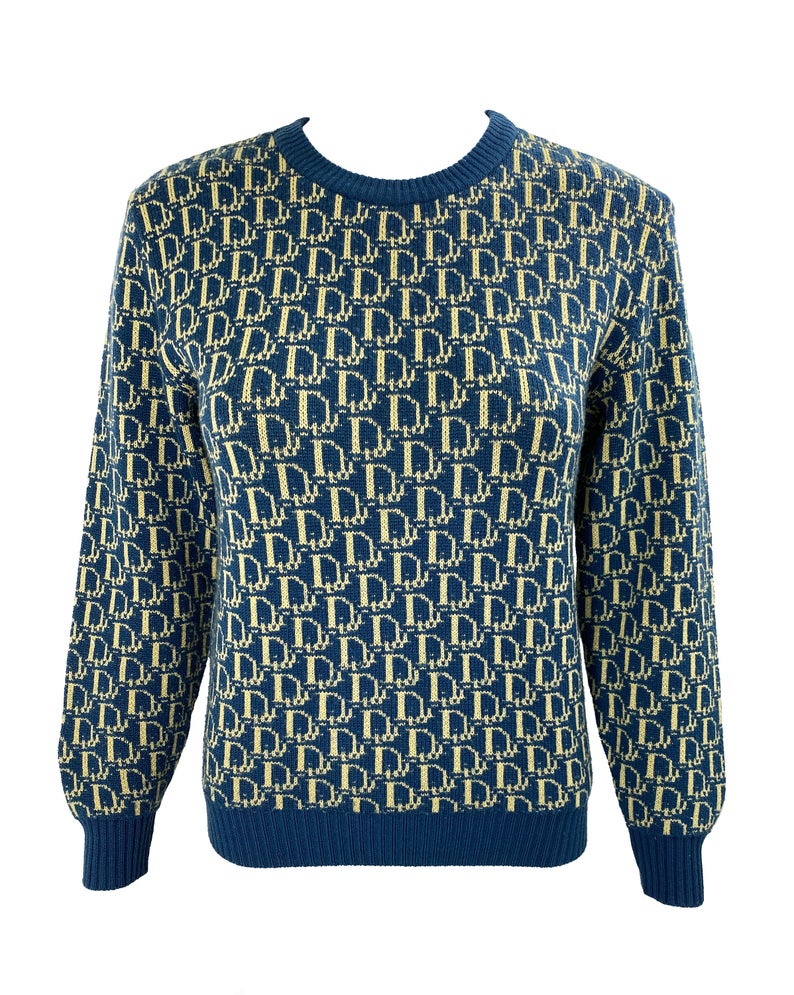 Fruit Vintage 1980s Christian Dior rare navy logo knit sweater. It features the iconic oblique print knitted into the weave of the fabric all over and a classic sweater cut.