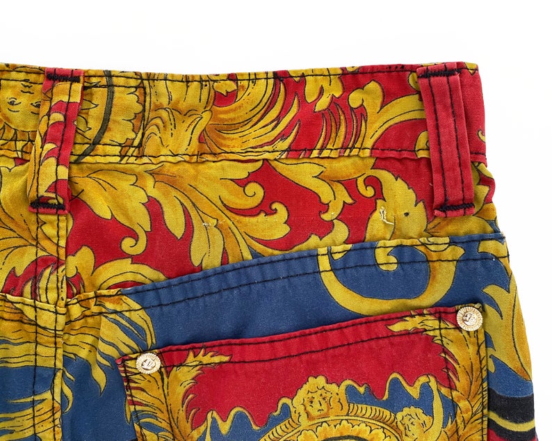 FRUIT Vintage Versace pants from the Jeans Couture collection. This is a lifetime Gianni Versace piece from the 1990s, it features the iconic 'Baroque' Print with Miami palms at the rear.