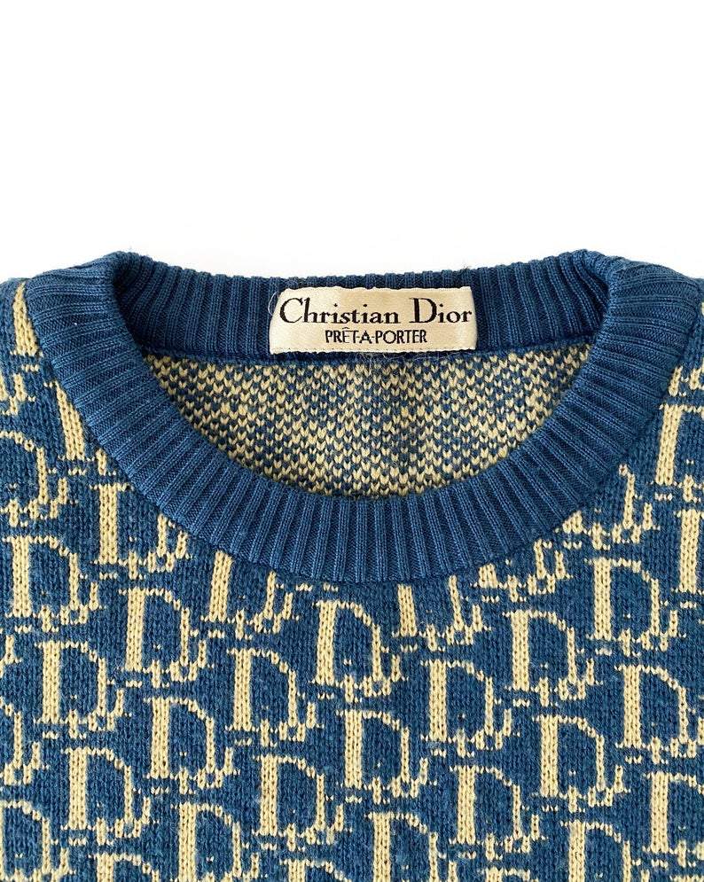 Fruit Vintage 1980s Christian Dior rare navy logo knit sweater. It features the iconic oblique print knitted into the weave of the fabric all over and a classic sweater cut.