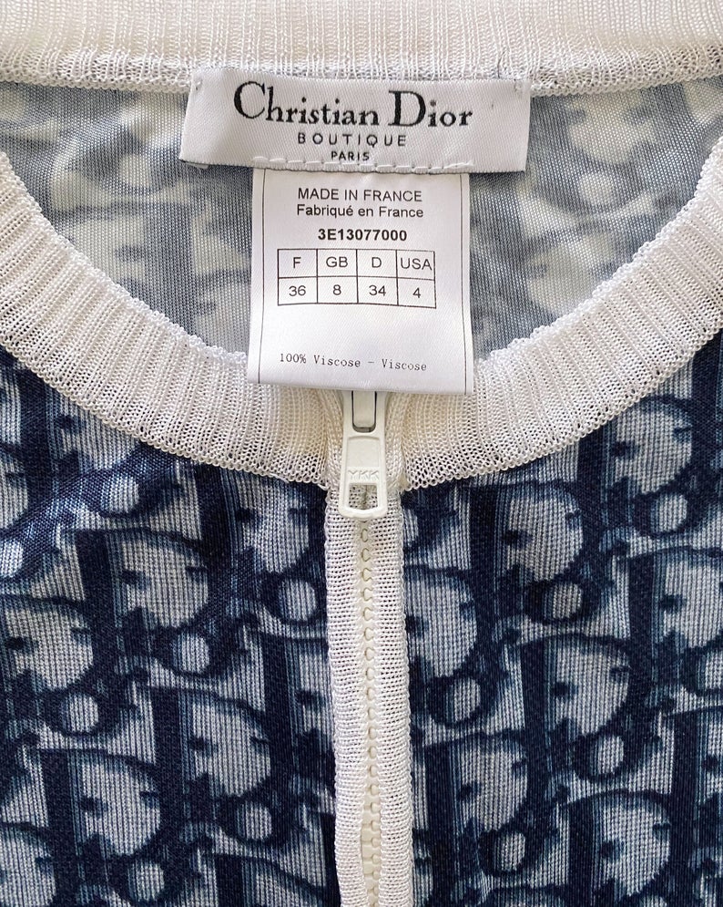 Fruit Vintage Christian Dior oblique logo zipper knit is about as iconic as it gets. Inspired by the original Dior trotter monogram canvas luggage and accessories, and re-released under the creative direction of John Galliano.