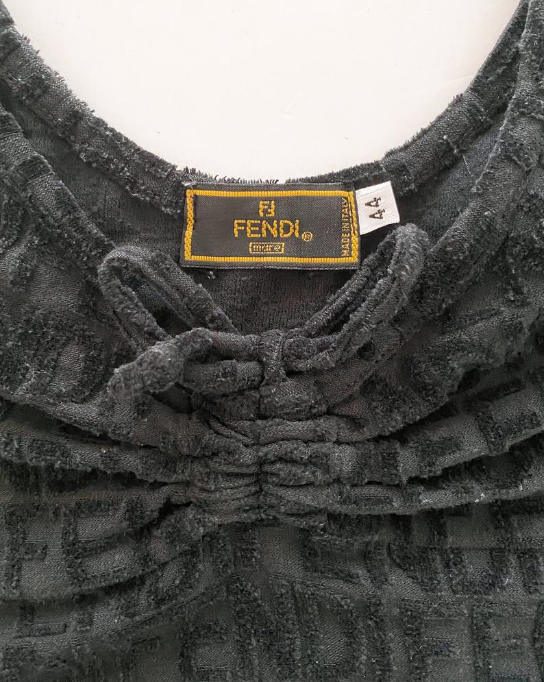 Fruit Vintage Fendi Logo flocked velvet dress dating to the 90s. It features a classic tank dress cut, bow front tie, and FENDI logo raised flocked letters all over.