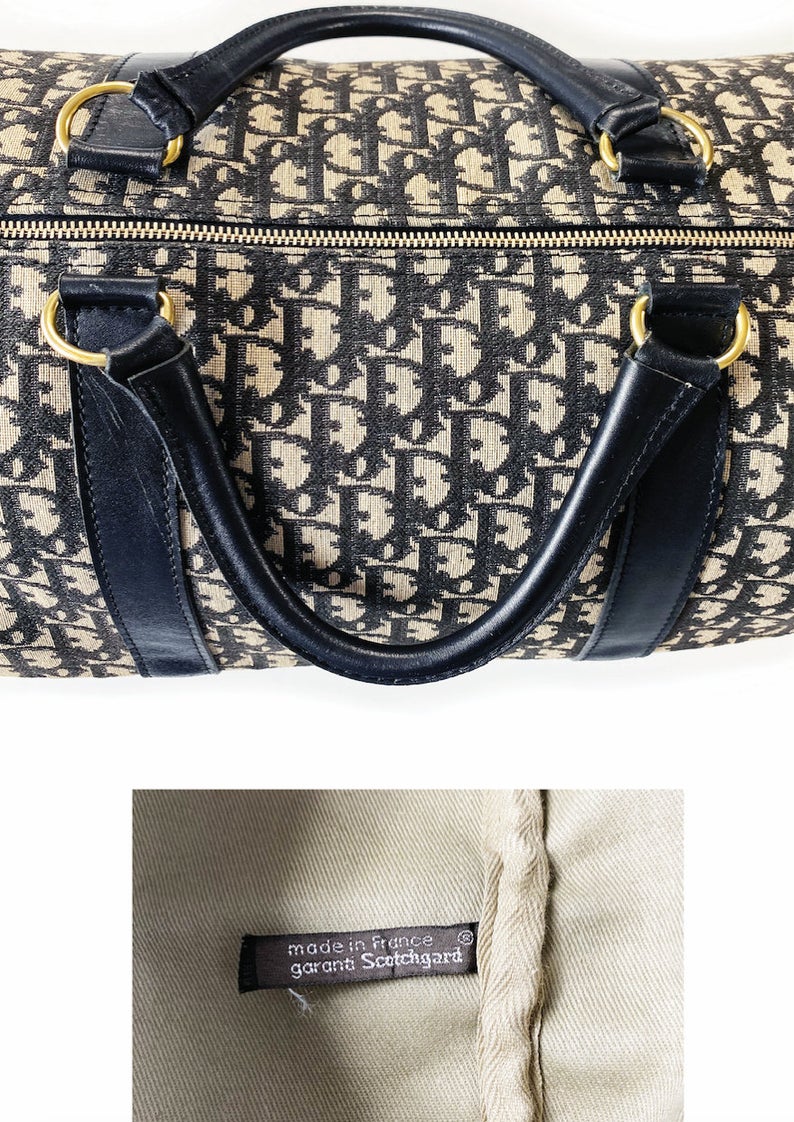 FRUIT vintage Christian Dior monogram logo trotter overnight travel bag dating to the 1980s. It features a classic duffel bag shape, dark navy leather trim and full cotton drill fabric lining.