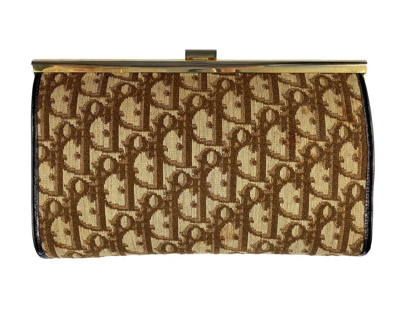 Fruit Vintage 1970s Christian Dior clutch bag with brown logo print canvas and featuring the iconic Dior 70's CD logo and gold hardware clip top closure