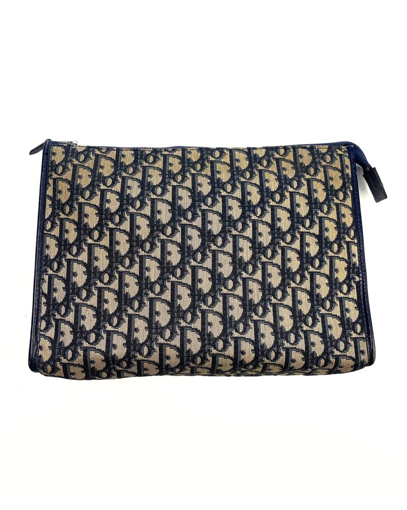 FRUIT Vintage Christian Dior 1980s navy trotter oblique monogram clutch bag. Features a classic pochette style shape with top zipper, internal pockets and vinyl lining.