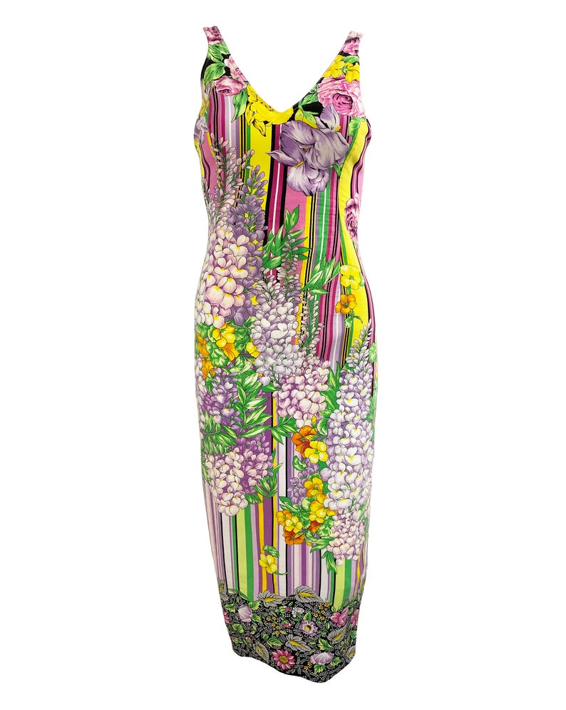 FRUIT Vintage Versus Versace dress designed by Gianni Versace in the 1990s. This graphic, floral print midi dress features a bold pattern on pattern print of floral and tailored cut.