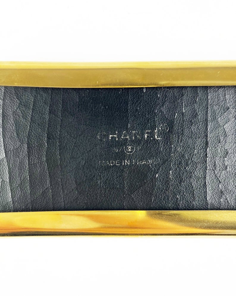 Fruit Vintage Chanel Logo Waist Belt dating to 1997. It features a very large gold bar with CHANEL logo at the front, internal logo foil stamp and date, and gold buckle at rear. 